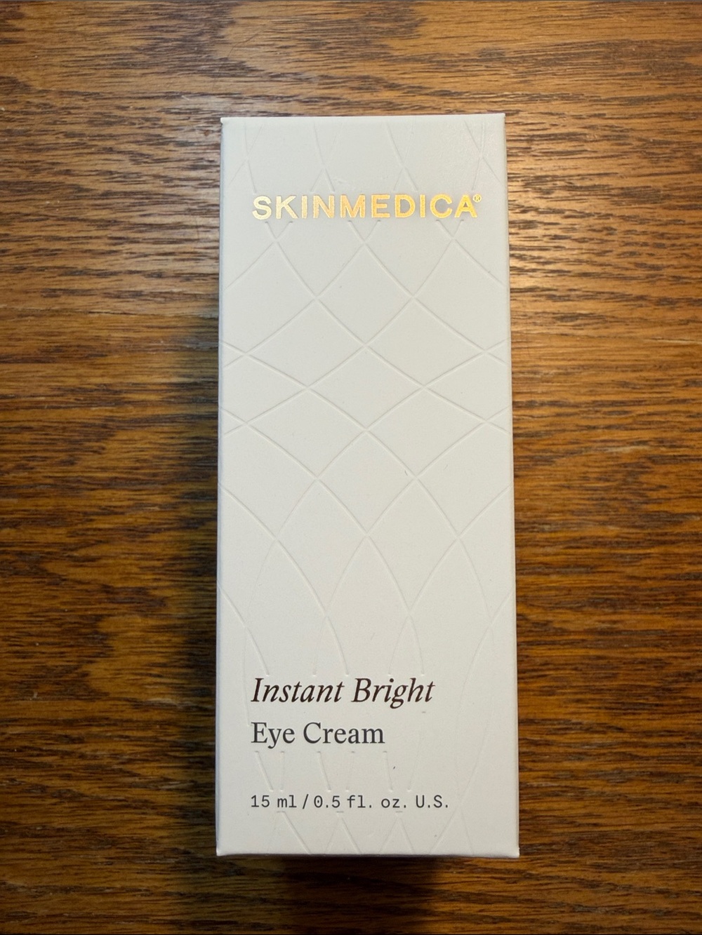 SkinMedica Instant Bright Eye Cream — white with gold logo